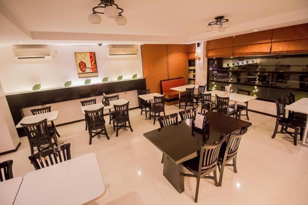The Red Palm Suites And Restaurant Butuan City Exterior photo